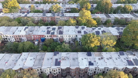 aerial view of solar panels on brownstone houses in a nyc neighborhood