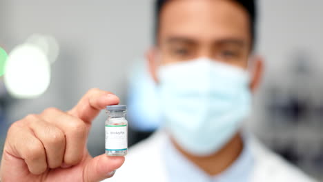 hand of doctor holding a vaccine for a virus