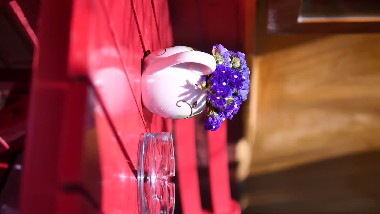 Floral Arrangement on Red Chair