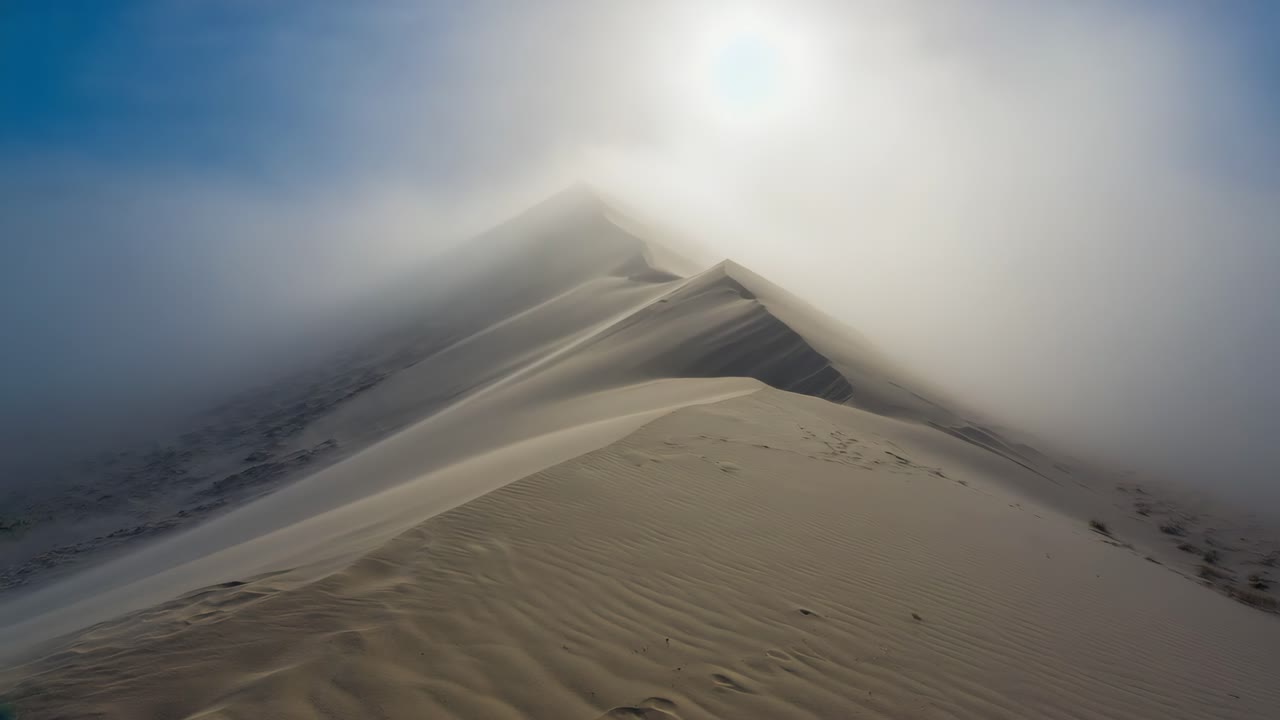 Misty Desert Dunes at Sunrise