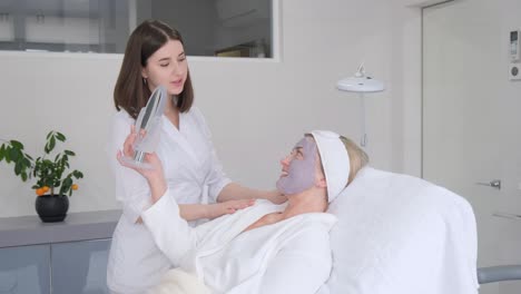 a calm and serene woman is enjoying a rejuvenating professional facial treatment at a modern spa setting