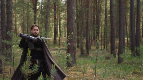 nobleman in armor with cape teaches peasants sword fighting