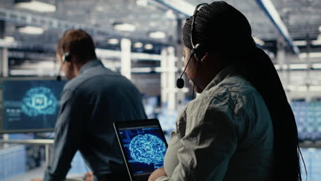 server room tech support employee using ai on tablet to guide clients