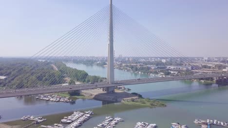 establishing 4k shot of ada bridge in belgrade, aerial ascending summer day