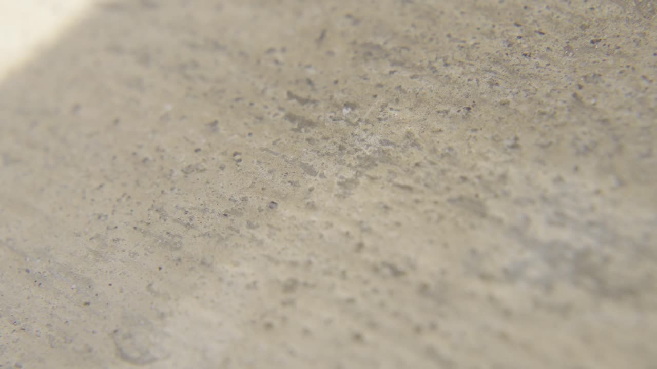 Extreme close-up of clay or soil texture with warm earthy tones and soft lighting. Ideal for design projects, natural visuals, and abstract art