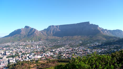Iconic flat-topped Table Mountain overlooking city bowl of Cape Town, reveal
