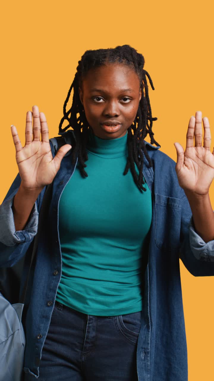 Young African American Woman Gesturing Stop with Hands