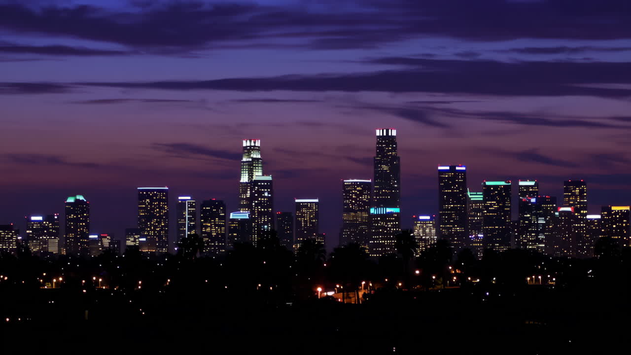 City skyline at dusk with illuminated buildings