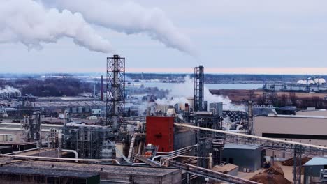 grim chimneys emitting smoke - stark reminder of global warming impact, drone