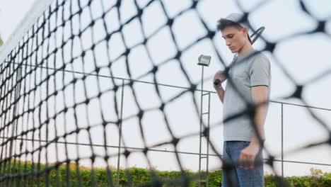 a man before a game of tennis tunes into the game throws the ball