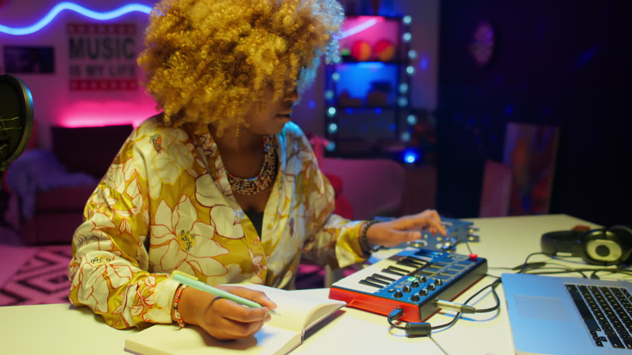 Woman Music Producer in a Home Recording Studio