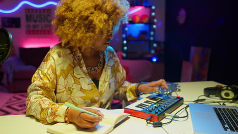 woman music producer in a home recording studio