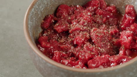 preparing raw beef carpaccio