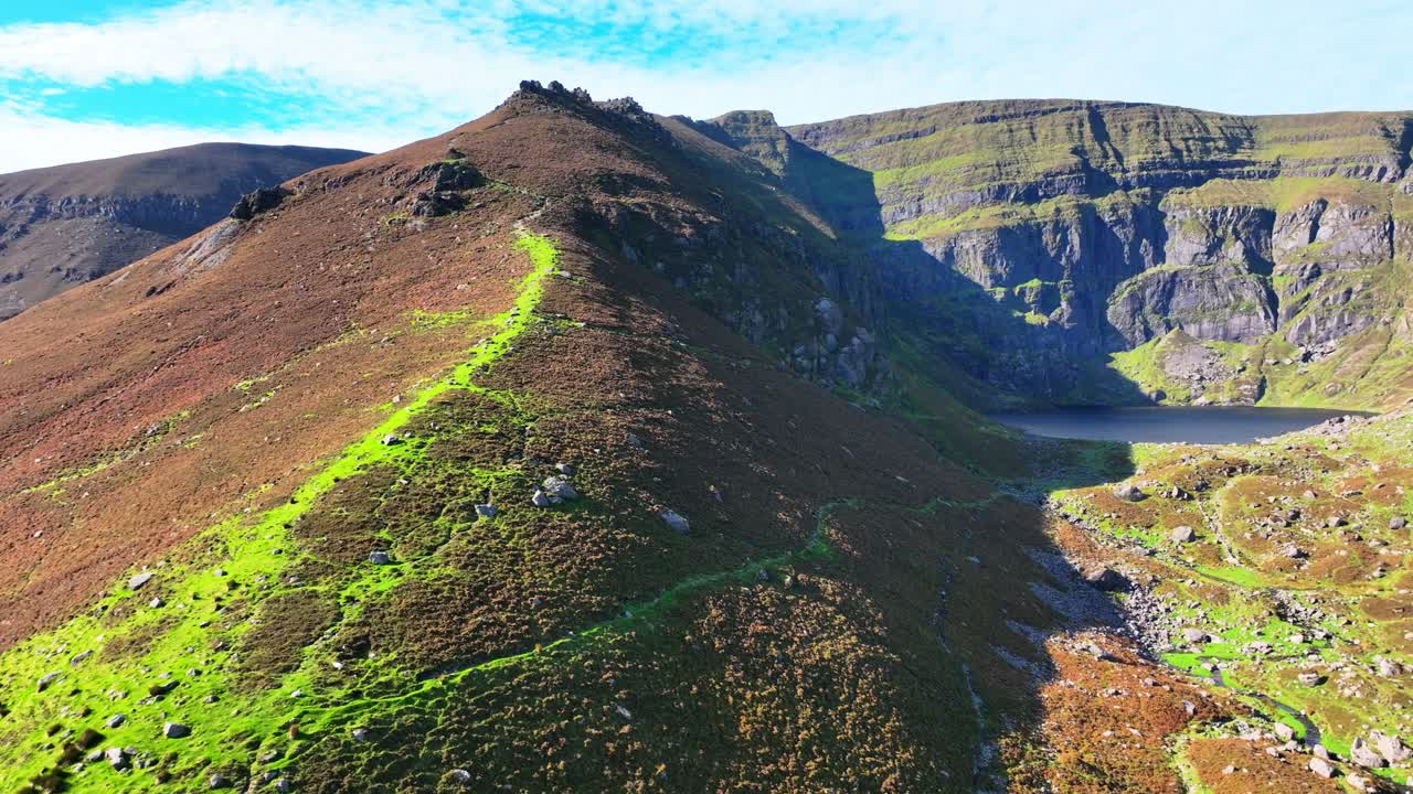 Irish Mountains panning shot of Coumshingaun Lake Comeragh Mountains Waterford Ireland natures wild beauty