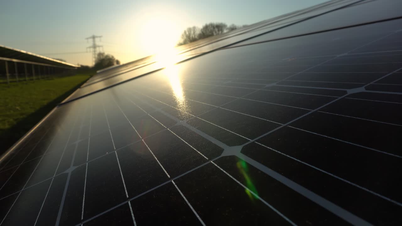 Sunset over solar farm solar panels, Q cells 300w Monocrystalline silicon, shallow focus