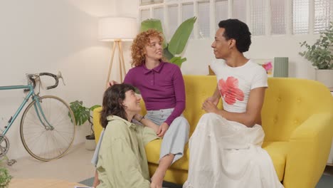 three people enjoying each other's company indoors