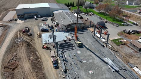 aerial shot of a construction site with machinery and buildings showcasing industrial development rich detail vibrant colors stunning visuals captivating scenes