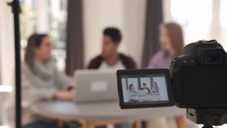 a group of people creating content for social media while making a video.
