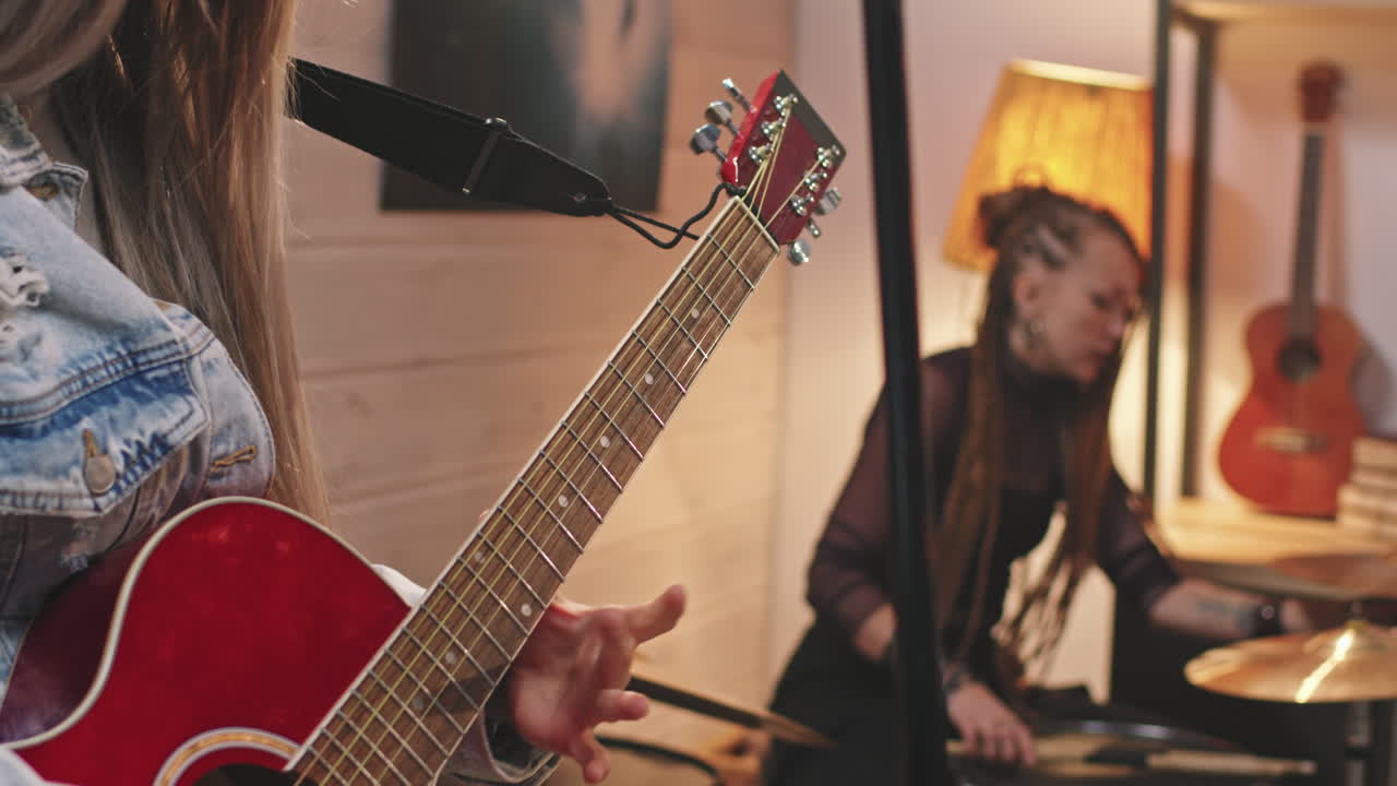 Girl Adjusting Guitar Before Playing
