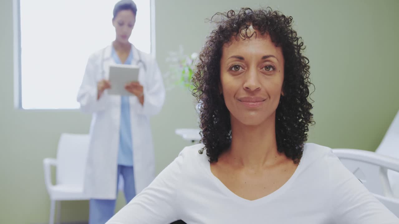 Close-up of African american disabled female patient sitting on wheelchair in the ward at hospital
