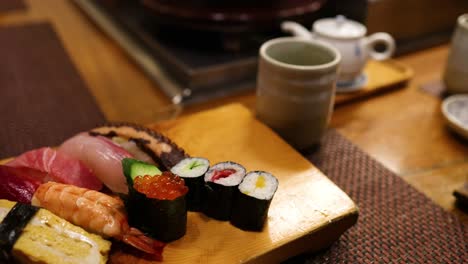 assorted sushi set on a wooden serving board