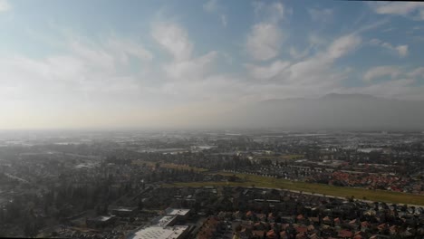 Aerial-Footage-of-smog-layer-above-the-Inland-Empire,-California