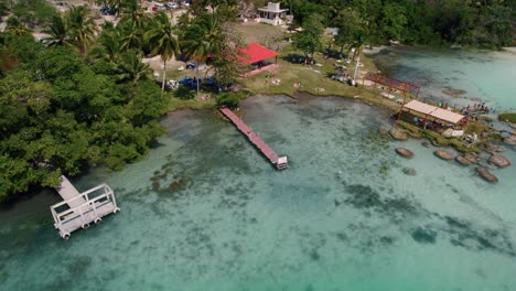 orbit shot of crystal clear lagoon water with green nature landscape, bacalar