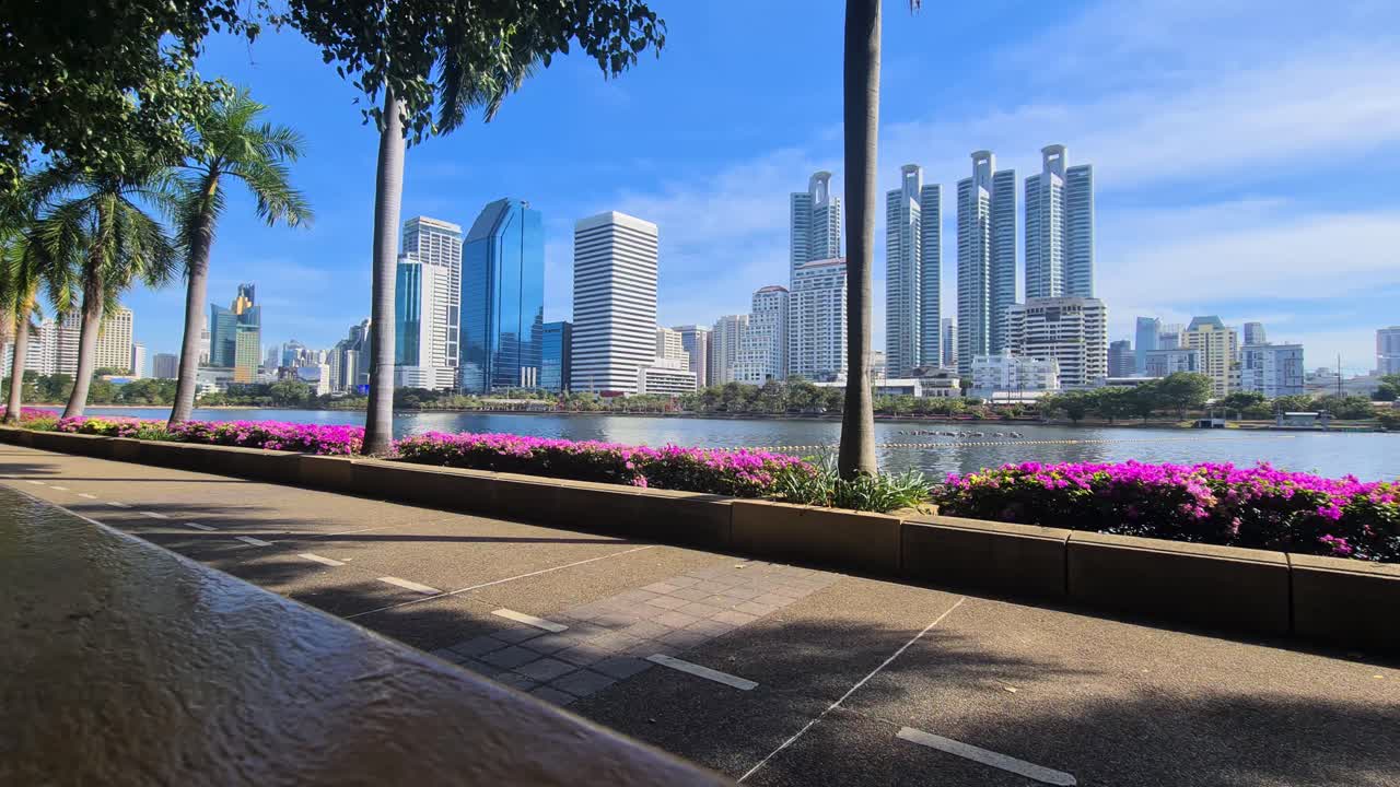 Bangkok Thailand Cityscape Skyline From Benjakiti Park and Lake