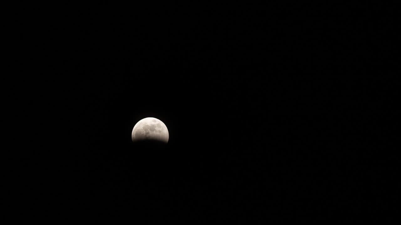 Wide Timelapse of the beginning of the Total Lunar Eclipse on March 14th, 2025 as the moon gets covered in Earth's shadow
