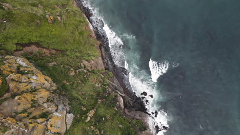 drone flight over rocks along the ocean , kamchatka