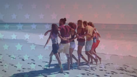 Multiple-blinking-stars-against-group-of-friends-walking-together-on-the-beach