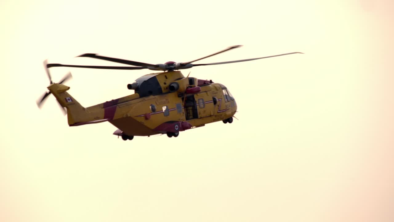 Close Up Profile View of a Flying CH-149 Cormorant SAR Helicopter