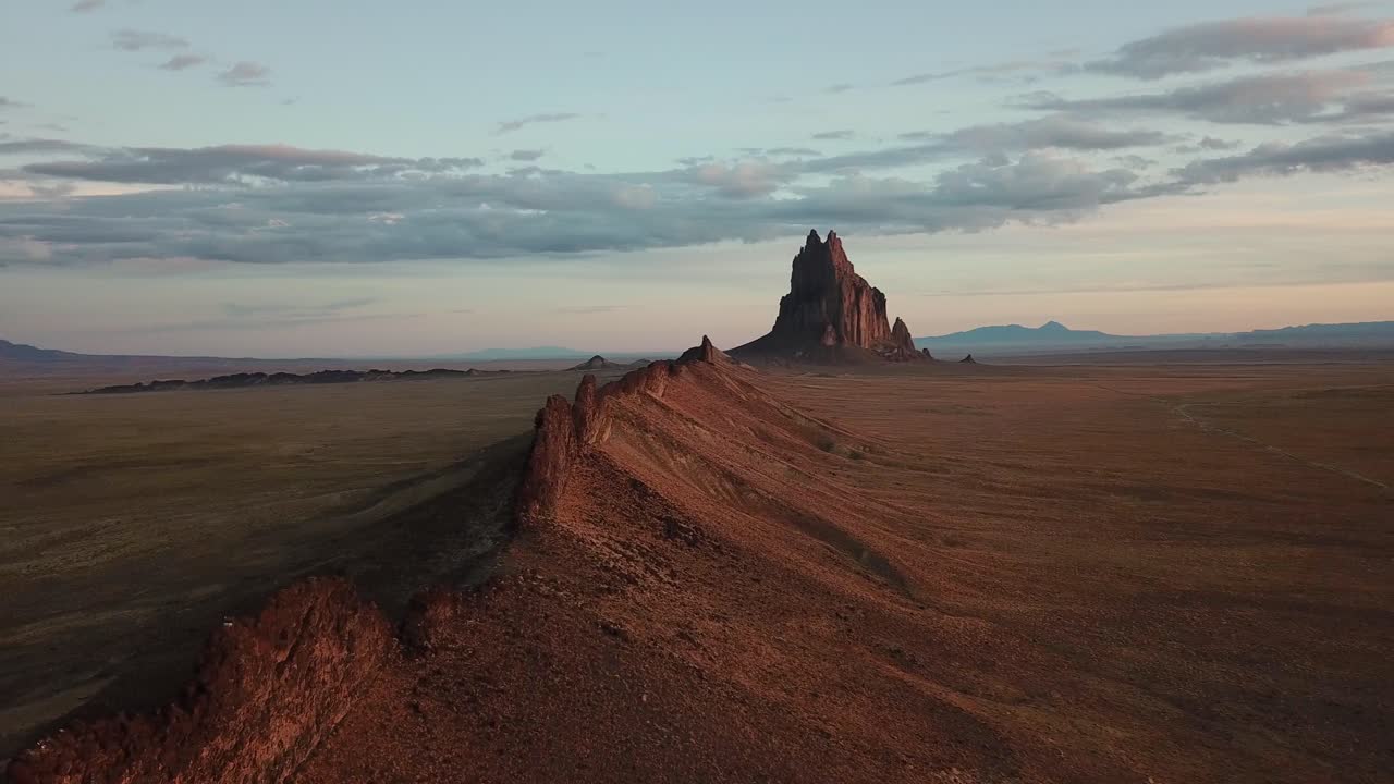 4k cinematic flight along Shiprock New Mexico rock formations
