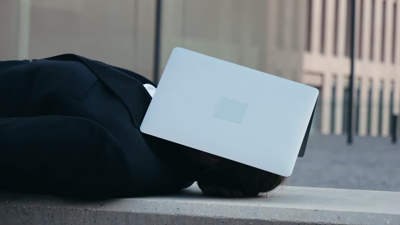 Exhausted person with laptop