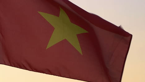 vietnam flag waving over sunset sky.