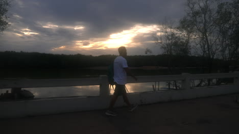 Man-walking-around-at-the-harbor-in-Thailand