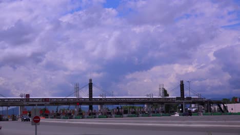 Trucks-and-cars-pass-through-a-tollbooth-on-a-French-motorway-1