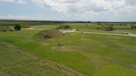 Grass-covered-hangars-and-runways-of-Shiraki-military-airbase,-Georgia