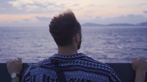 young man traveling on the sea.