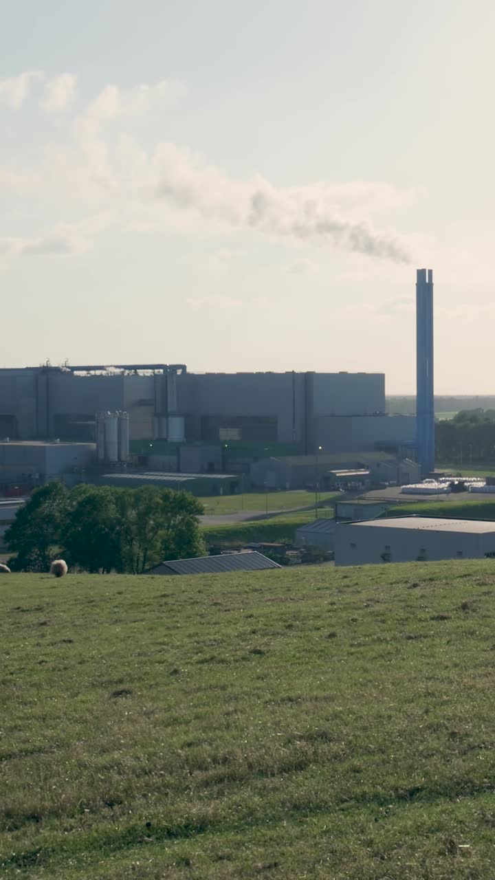 Industrial Plant with Emitting Chimneys in a Rural Landscape