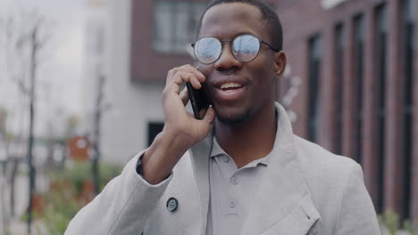 man talking on phone in city