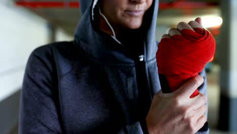 woman wearing red band in hand 4k