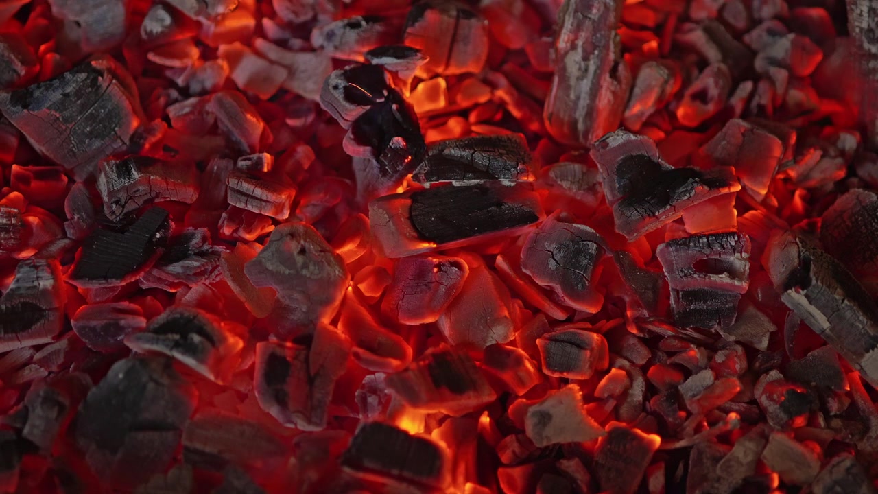 Close-up of Glowing Red Embers and Burning Charcoal