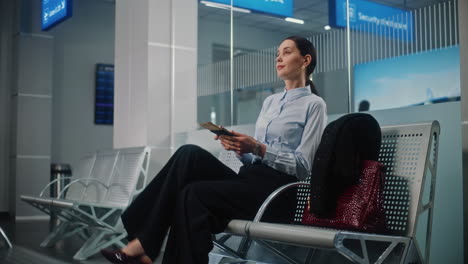 businesswoman waiting at airport security