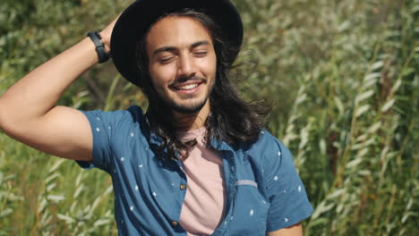 smiling man in a hat