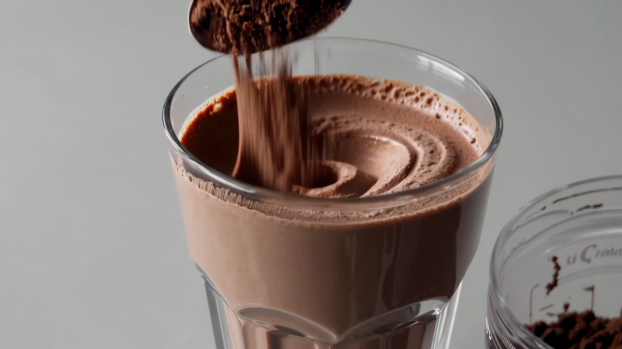 Preparing a Chocolate Drink with Powder and Spoon