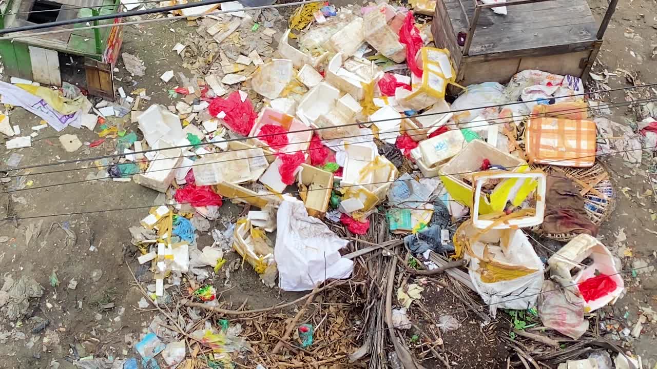 Plastic and Styrofoam boxes causing environmental pollution in Bangladesh. - top down rotating shot