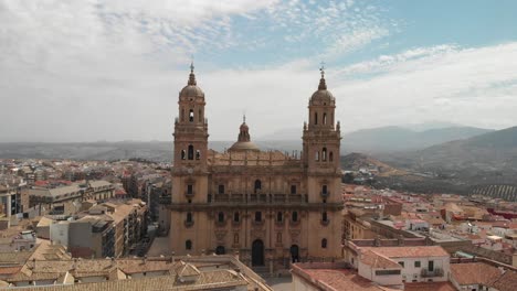 Spain-Jaen-Cathedral,-Catedral-de-Jaen,-flying-shoots-of-this-old-church-with-a-drone-at-4k-24fps-using-a-ND-filter-also-it-can-be-seen-the-old-town-of-Jaen