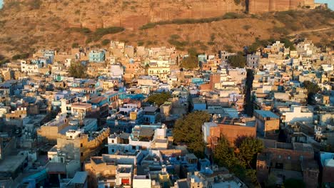 sunrise fly over of densely populated, blue city of jodhpur, rajasthan, india