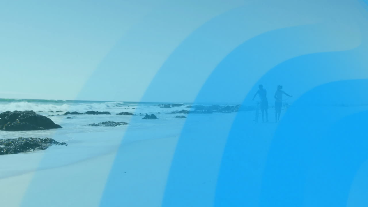 Walking on beach, people with blue wave animation overlay, enjoying ocean view